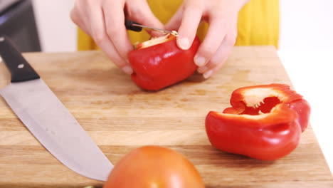 Close-up-on-a-woman-carving-sweet-pepper-