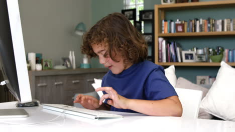 Boy-typing-on-the-keyboard