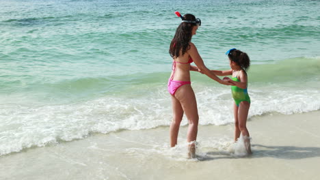 Mother-and-daughter-playing-in-water