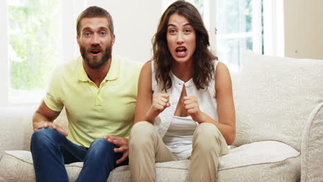 Couple-getting-excited-in-front-of-the-tv