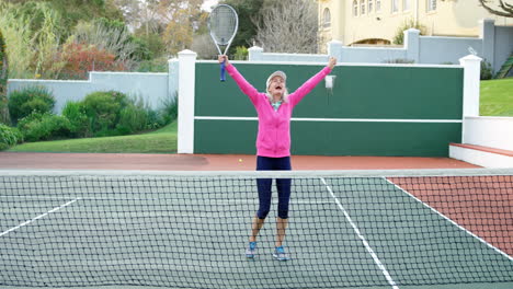 Senior-woman-cheering-in-tennis-court-4k