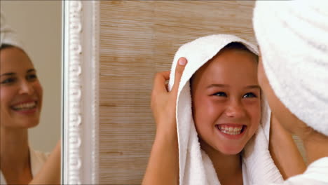 Cute-mother-and-daughter-in-the-bathroom