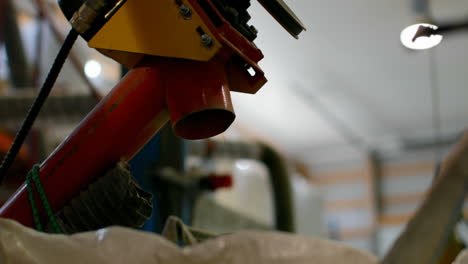 Close-up-of-wheat-thresher-parts-in-warehouse-4k