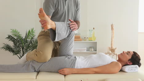 Chiropractor-and-woman-doing-special-exercises