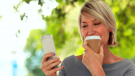 Smiling-woman-using-smartphone