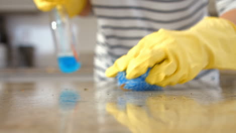 Woman-cleaning-counter