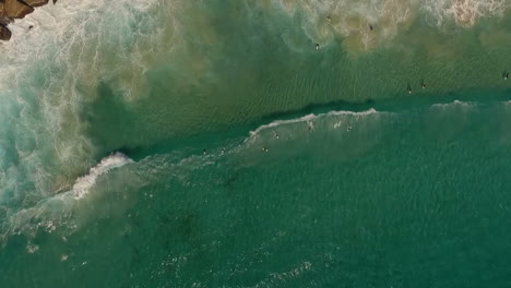Aerial-view-of-shore-where-people-surfing