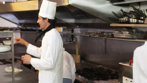 Group-of-chefs-cheering-and-putting-their-hands-together