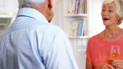 Mature-man-giving-a-flower-to-his-wife-