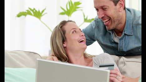 Smiling-couple-making-online-shopping-