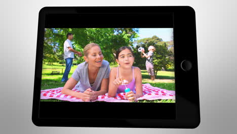 Animated-tablet-computer-displaying-videos-about-family-leisure