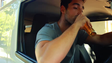 Drunk-man-slumped-on-steering-wheel