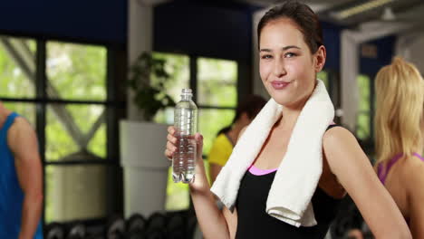 Happy-brunette-drinking-water