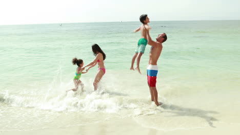 Family-playing-in-water