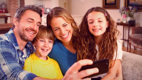 Cute-family-taking-selfie-on-the-couch