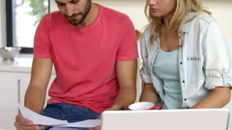 Couple-reading-paper-together