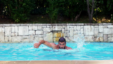 Handsome-man-swimming-on-pool