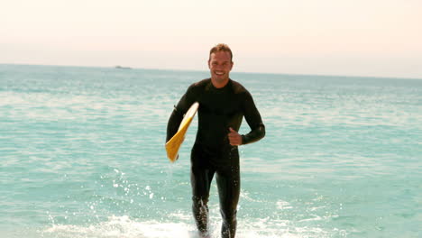 Man-with-surfboard-running