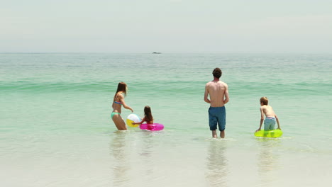 Happy-family-playing-in-water