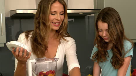 Cute-family-preparing-a-smoothie