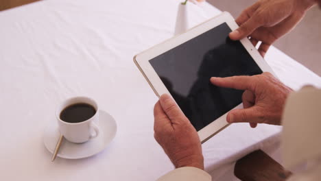 Senior-man-using-digital-tablet