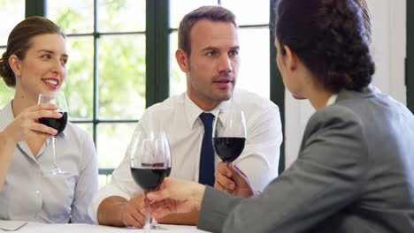 Business-team-having-a-meeting-in-restaurant