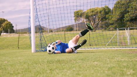 Goalkeeper-in-blue-making-a-save