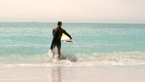 Man-with-surfboard-running