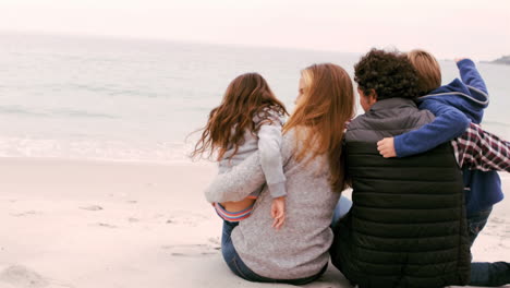 Family-is-sitting-on-the-beach