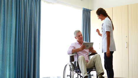 Nurse-giving-tablet-to-his-patient-