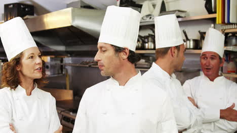 Group-of-chef-talking-and-smiling-at-camera