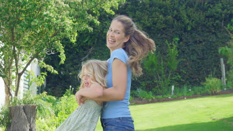 Mother-and-daughter-having-fun-in-the-garden