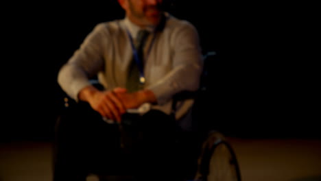 Happy-mature-Caucasian-disabled-businessman-in-seminar-on-stage-in-auditorium-4k