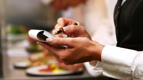 Waitress-checking-order