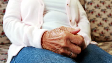 Extreme-close-up-view-of-retired-person-rubbing-her-hands-together