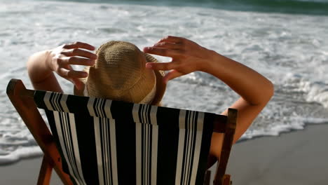 Woman-sitting-in-a-sunchair