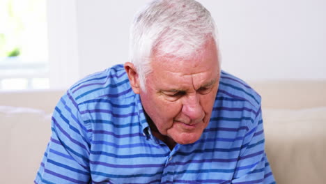 Mature-man-drinking-something-and-reading-a-book