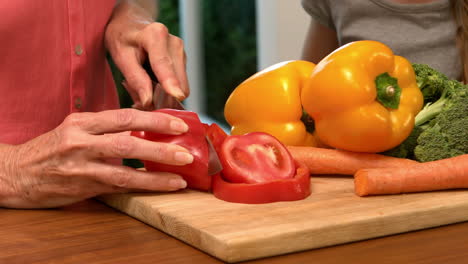 Woman-cutting-bell-pepper