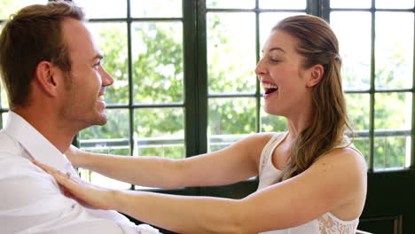 Couple-hugging-in-a-restaurant-after-proposal