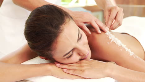 Pretty-woman-enjoying-a-salt-scrub-massage