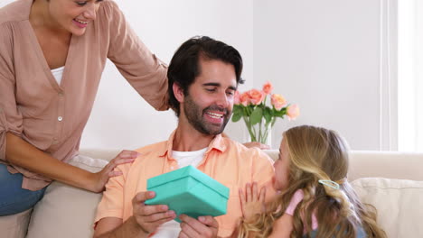 Daughter-giving-a-present-to-her-father-