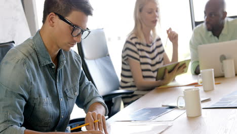 Casual-businessman-checking-documents