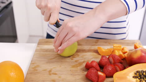 Close-up-on-a-woman-carving-some-fruits