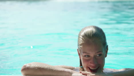 Attractive-woman-swimming-in-pool
