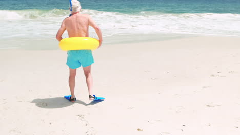 Senior-man-going-in-the-sea