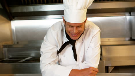 Chef-looking-proudly-at-the-plate