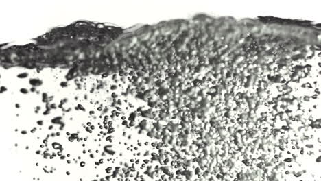 Tiny-bubbles-moving-to-water-surface-in-super-slow-motion