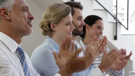 Business-man-and-woman-clapping-in-their-hands