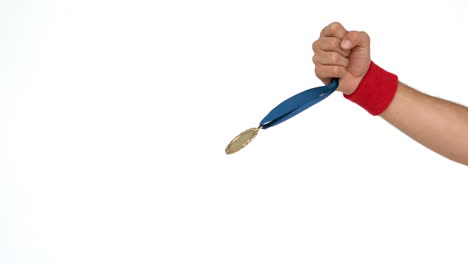 Hand-holding-up-medal