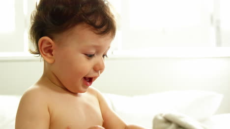 Close-up-baby-playing-with-hat